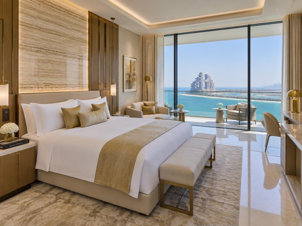 Royal Club Ocean King bedroom with private balcony overlooking the Arabian Gulf